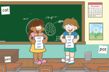 in a classroom, two older students holding a checklist with words such as cat, pot and pen, with the words displayed around the room